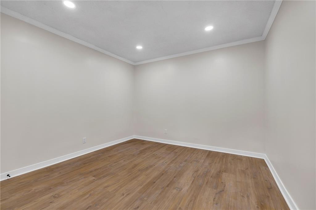 2060 Baker Road Northwest Atlanta, GA 30318 - Photo 10 of 24 a view of room with wooden floor