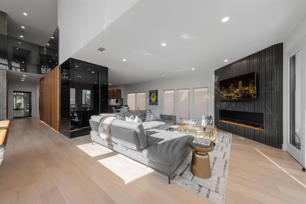 3731 Gilbert Avenue, Unit 3 Dallas, TX 75219 - Photo 15 of 40 a living room with furniture and a flat screen tv
