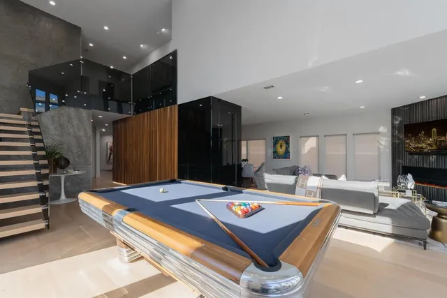 a living room with game table