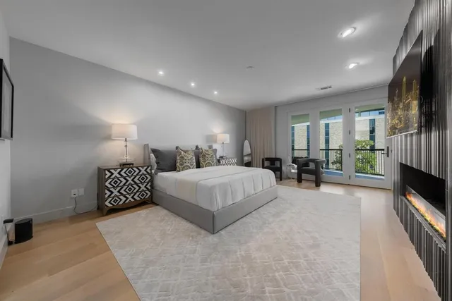 a large bedroom with a large bed and a window