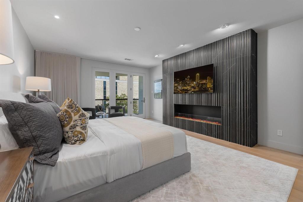 3731 Gilbert Avenue, Unit 3 Dallas, TX 75219 - Photo 29 of 40 a large bedroom with a large bed and a window