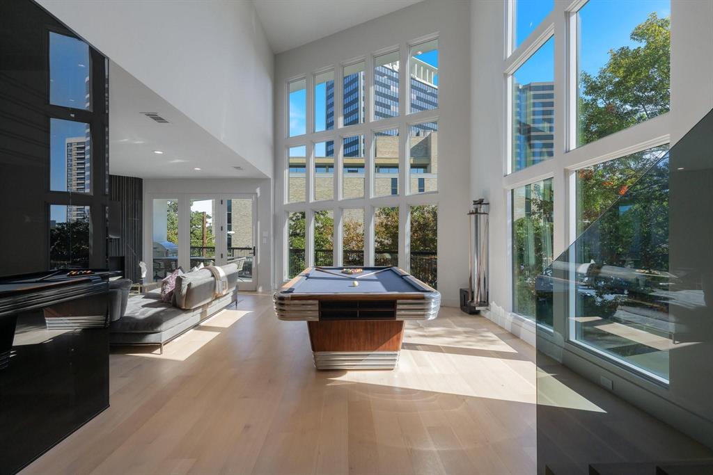 3731 Gilbert Avenue, Unit 3 Dallas, TX 75219 - Photo 3 of 40 a living room with furniture and a large window
