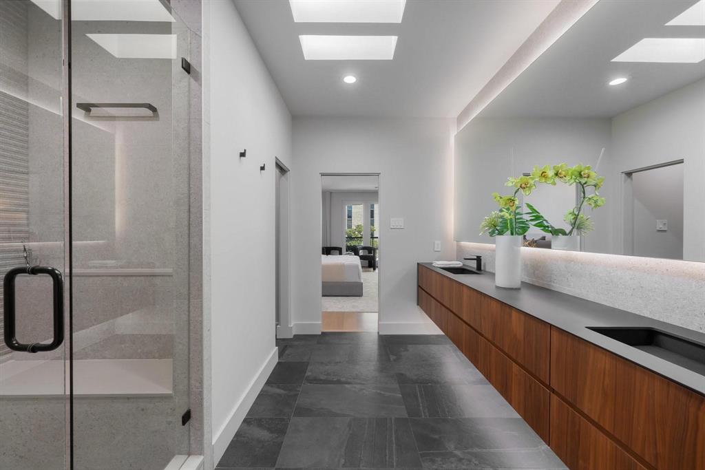 3731 Gilbert Avenue, Unit 3 Dallas, TX 75219 - Photo 31 of 40 a large white room with a large mirror