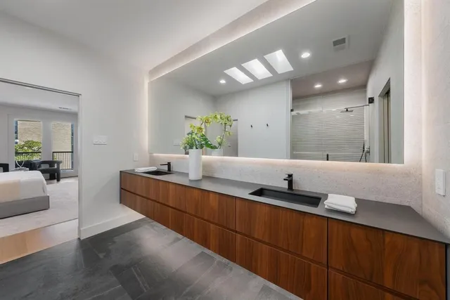 a balcony with furniture and a potted plant