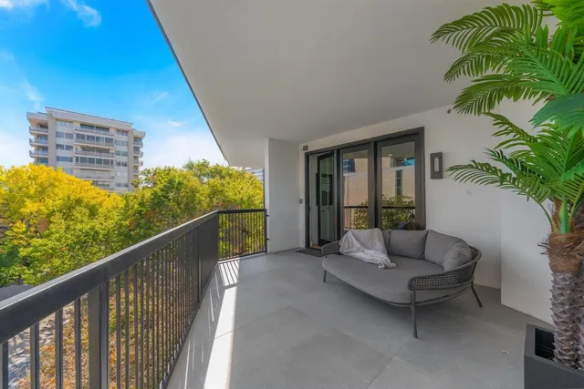 a bedroom with a bed and a large mirror in it