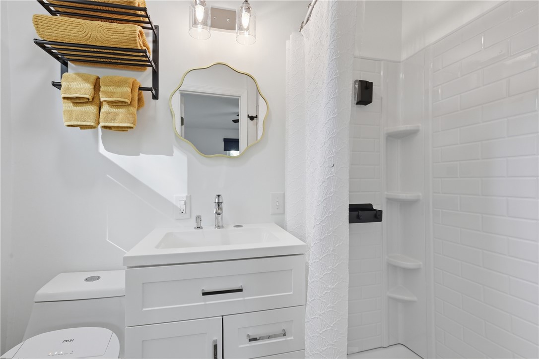 623 West Springwood Drive Seneca, SC 29672 - Photo 12 of 50 This bright bathroom features subway tile, modern fixtures, and ample storage within the vanity.