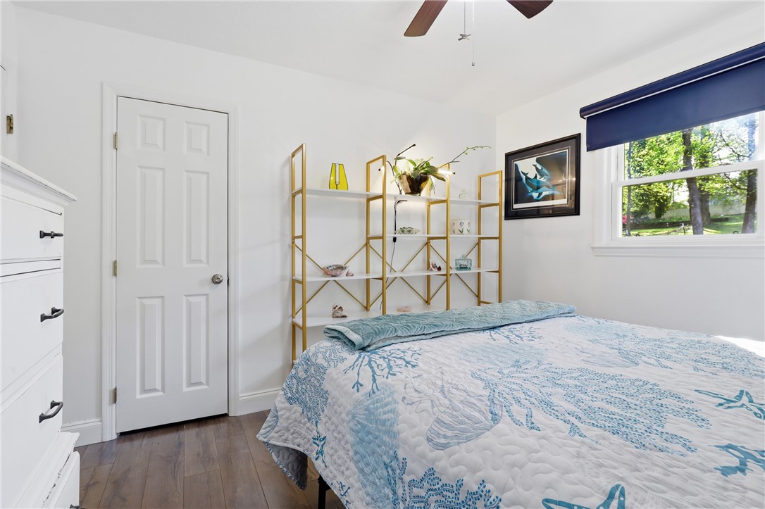 623 West Springwood Drive Seneca, SC 29672 - Photo 13 of 50 This cozy bedroom features warm wood flooring and a refreshing window view, ideal for serene mornings.