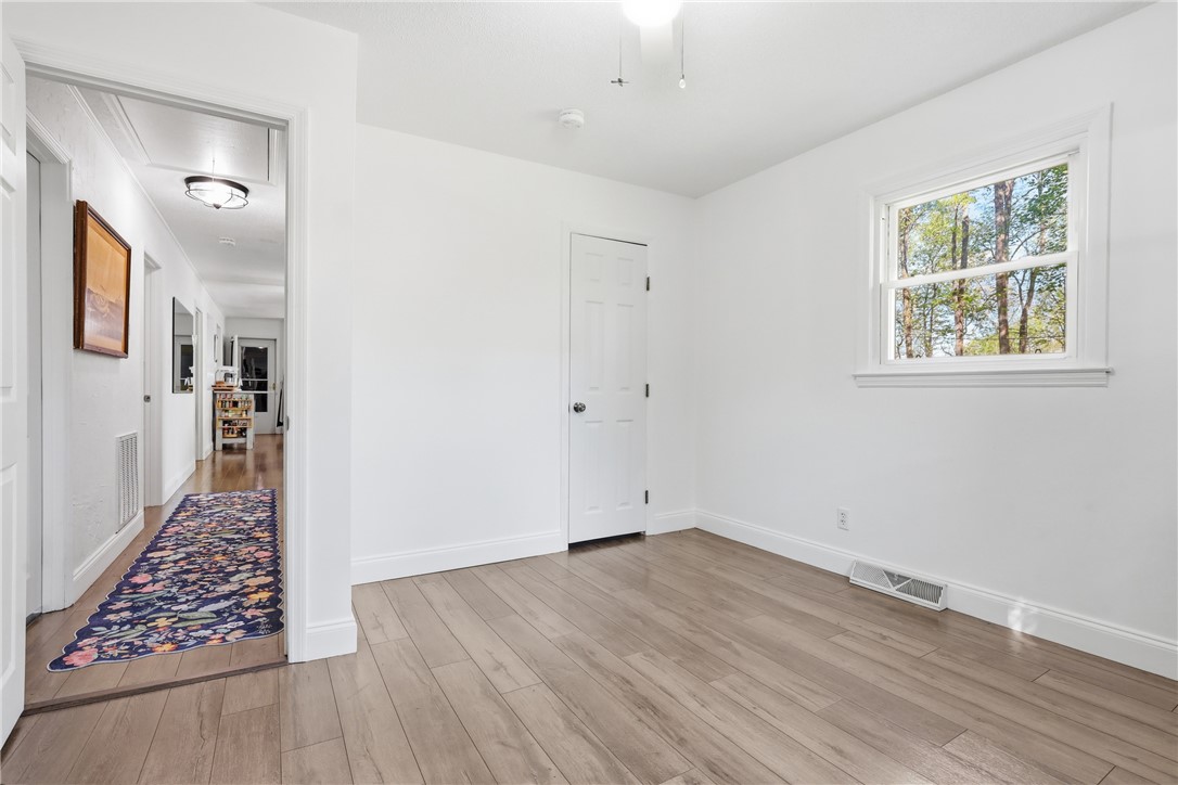 623 West Springwood Drive Seneca, SC 29672 - Photo 19 of 50 This bright room features beautiful hardwood floors and ample natural light.