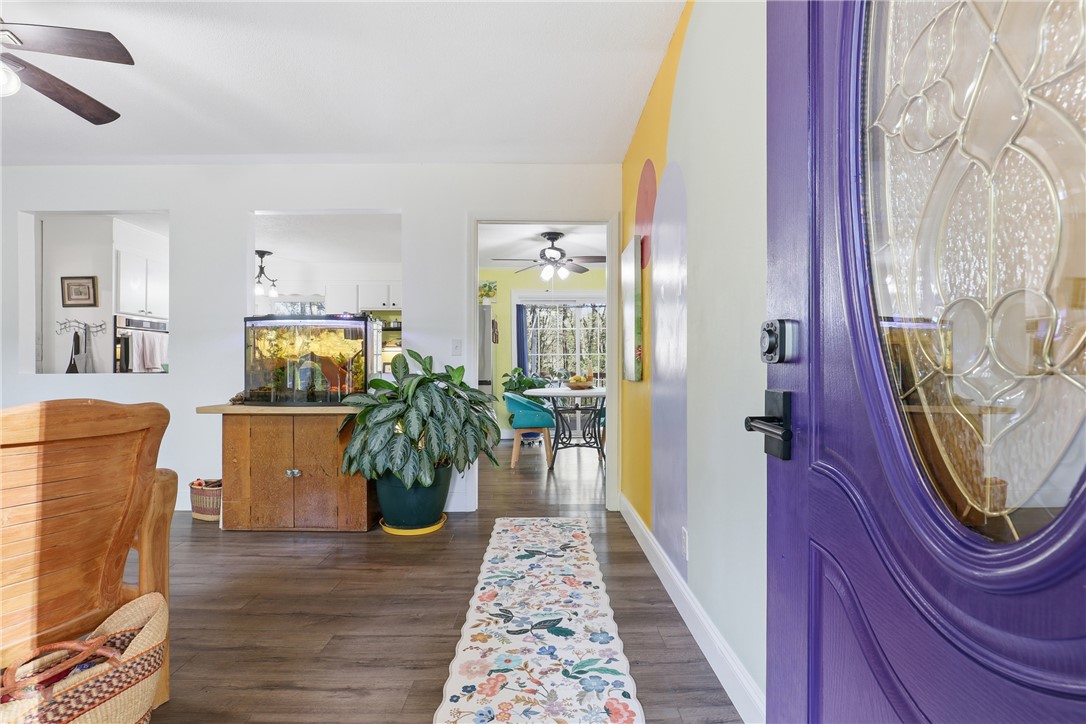 623 West Springwood Drive Seneca, SC 29672 - Photo 2 of 50 Step into this welcoming entryway, featuring wood flooring and inviting access to the rest of the home.