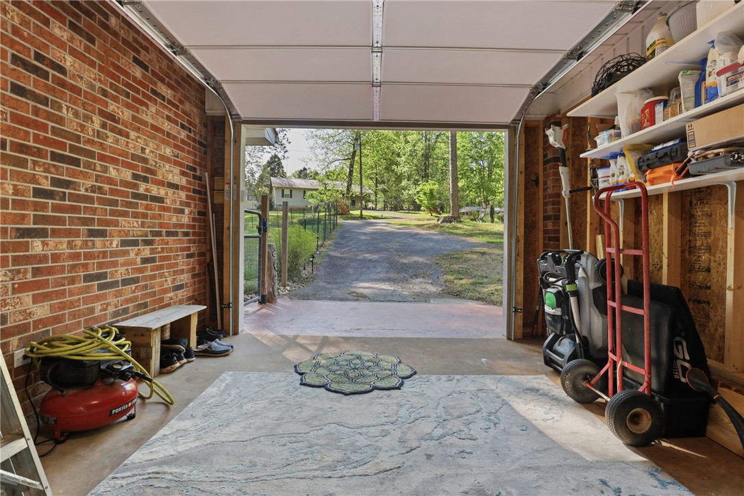 623 West Springwood Drive Seneca, SC 29672 - Photo 22 of 50 This spacious garage offers ample storage and direct access to a serene, tree-lined driveway.