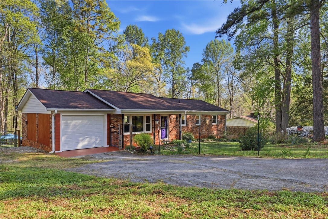623 West Springwood Drive Seneca, SC 29672 - Photo 26 of 50 This charming home features a classic brick exterior and a lush, expansive yard.