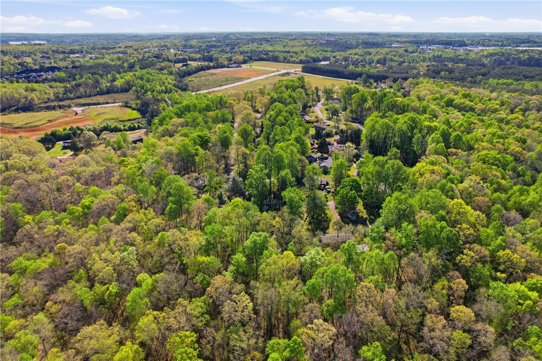 623 West Springwood Drive Seneca, SC 29672 - Photo 31 of 50 This elevated view captures a serene expanse of verdant woodlands and tranquil homes.