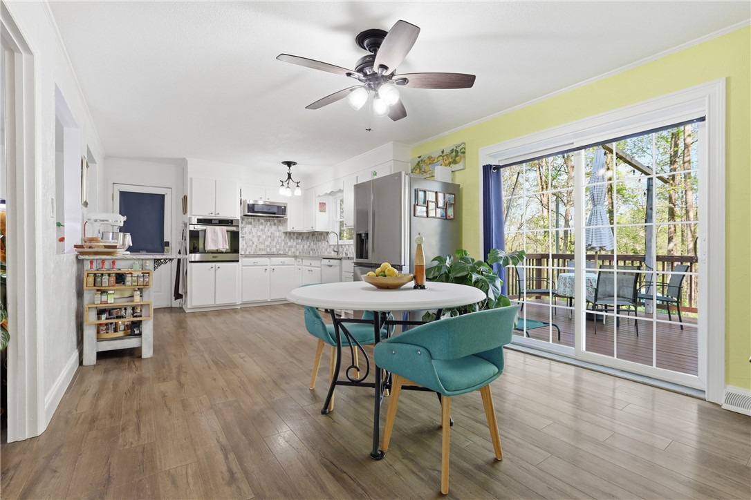 623 West Springwood Drive Seneca, SC 29672 - Photo 35 of 50 This spacious kitchen offers a seamless connection to the outdoors, perfect for modern living and entertaining.