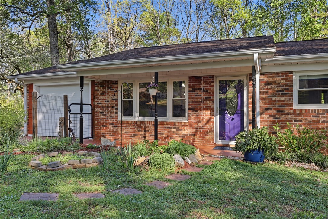 623 West Springwood Drive Seneca, SC 29672 - Photo 36 of 50 This charming residence features a classic brick exterior and a welcoming front entrance.