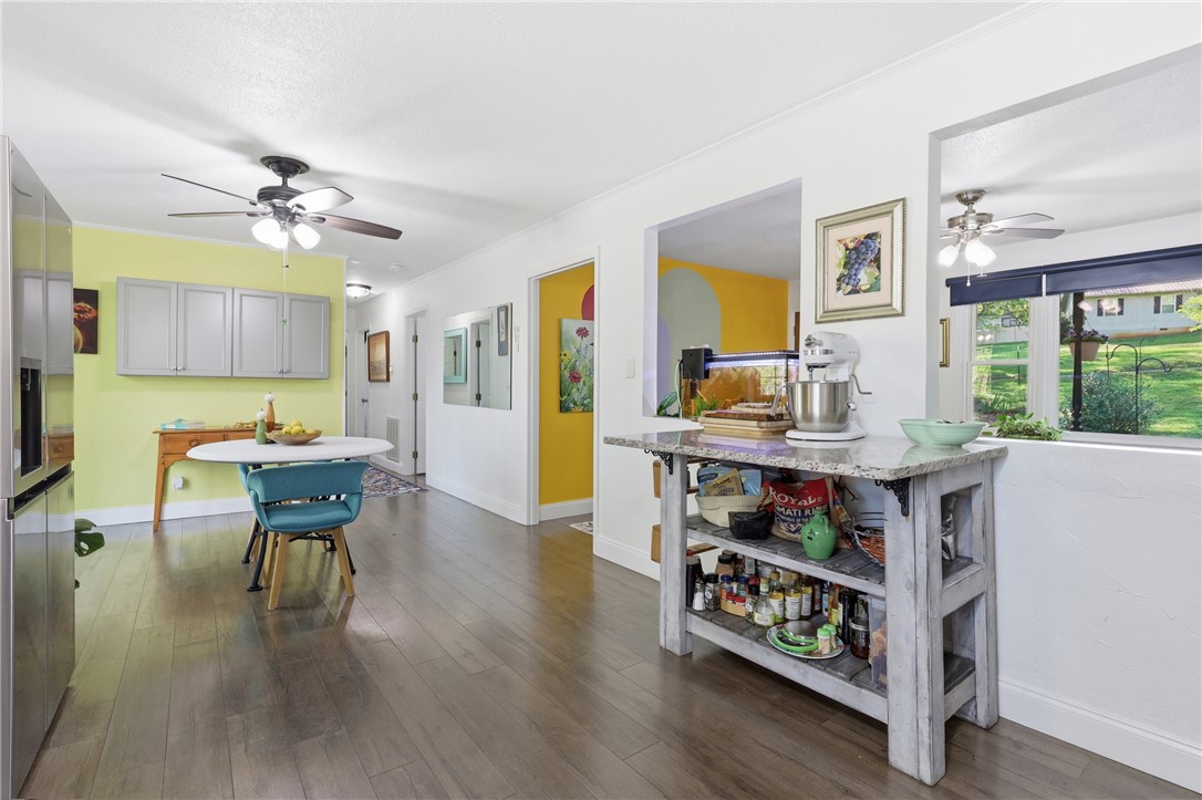 623 West Springwood Drive Seneca, SC 29672 - Photo 39 of 50 This vibrant kitchen and dining area features sleek flooring, creating an inviting space for gatherings.