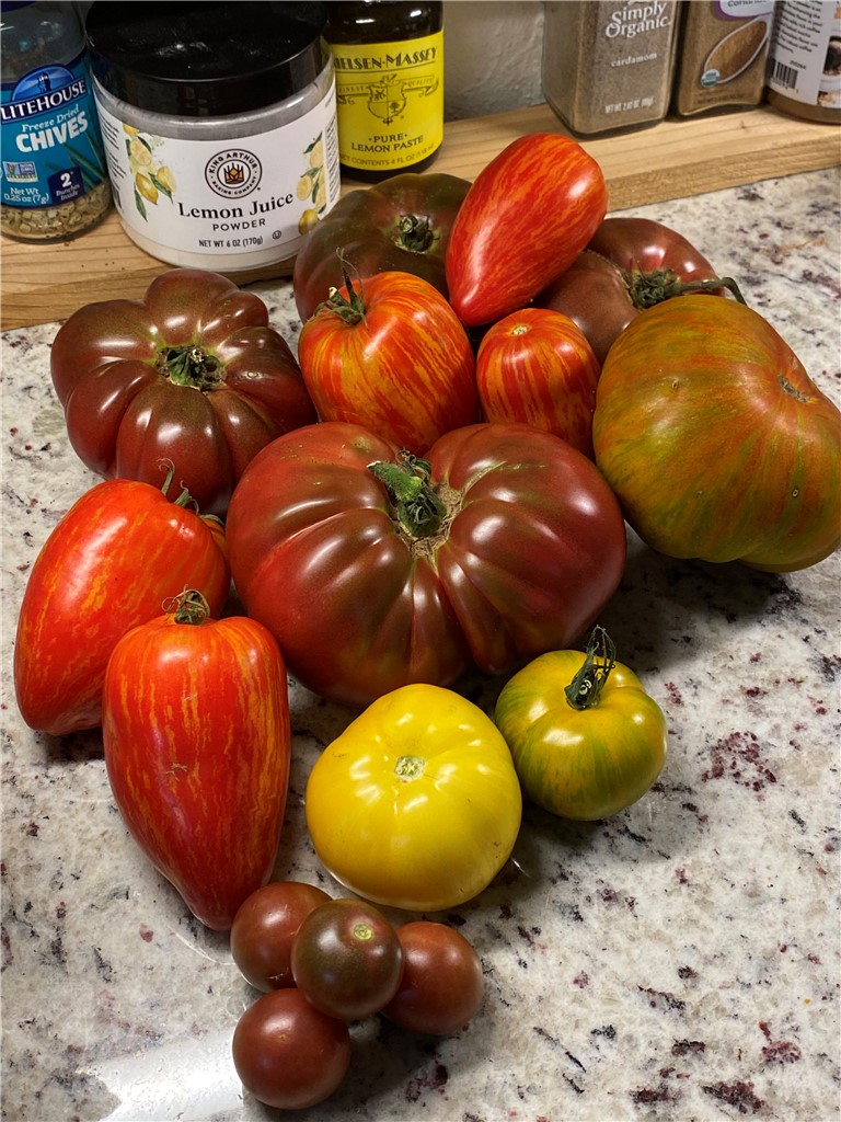 623 West Springwood Drive Seneca, SC 29672 - Photo 41 of 50 This counter showcases a vibrant display of fresh produce, offering a delightful kitchen accent.