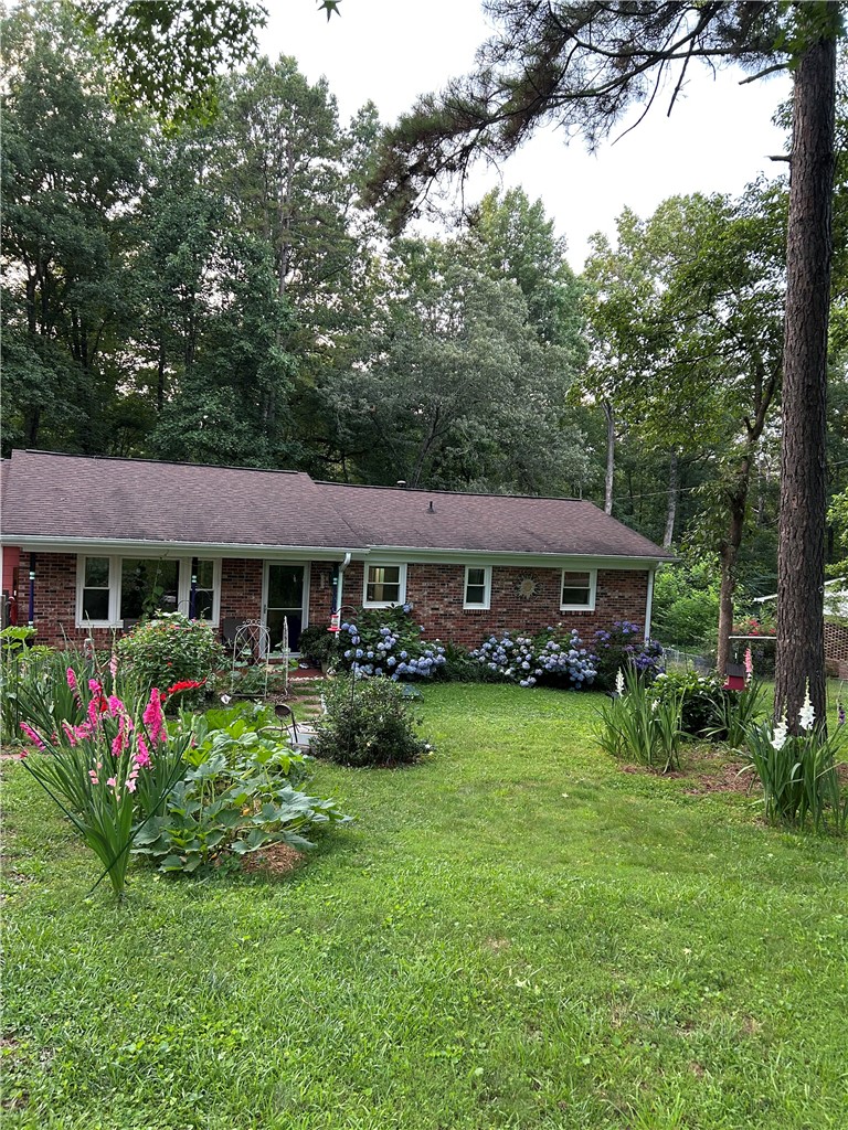 623 West Springwood Drive Seneca, SC 29672 - Photo 47 of 50 This charming home offers a lush yard with vibrant landscaping.