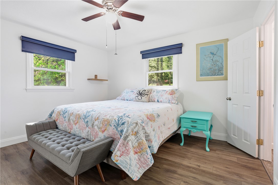623 West Springwood Drive Seneca, SC 29672 - Photo 9 of 50 This bright and inviting bedroom features warm wood flooring and ample natural light.