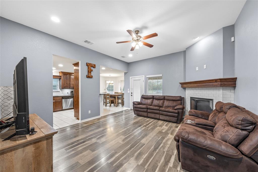 109 Ruby Circle Hewitt, TX 76643 - Photo 3 of 14 a living room with furniture a flat screen tv and a fireplace