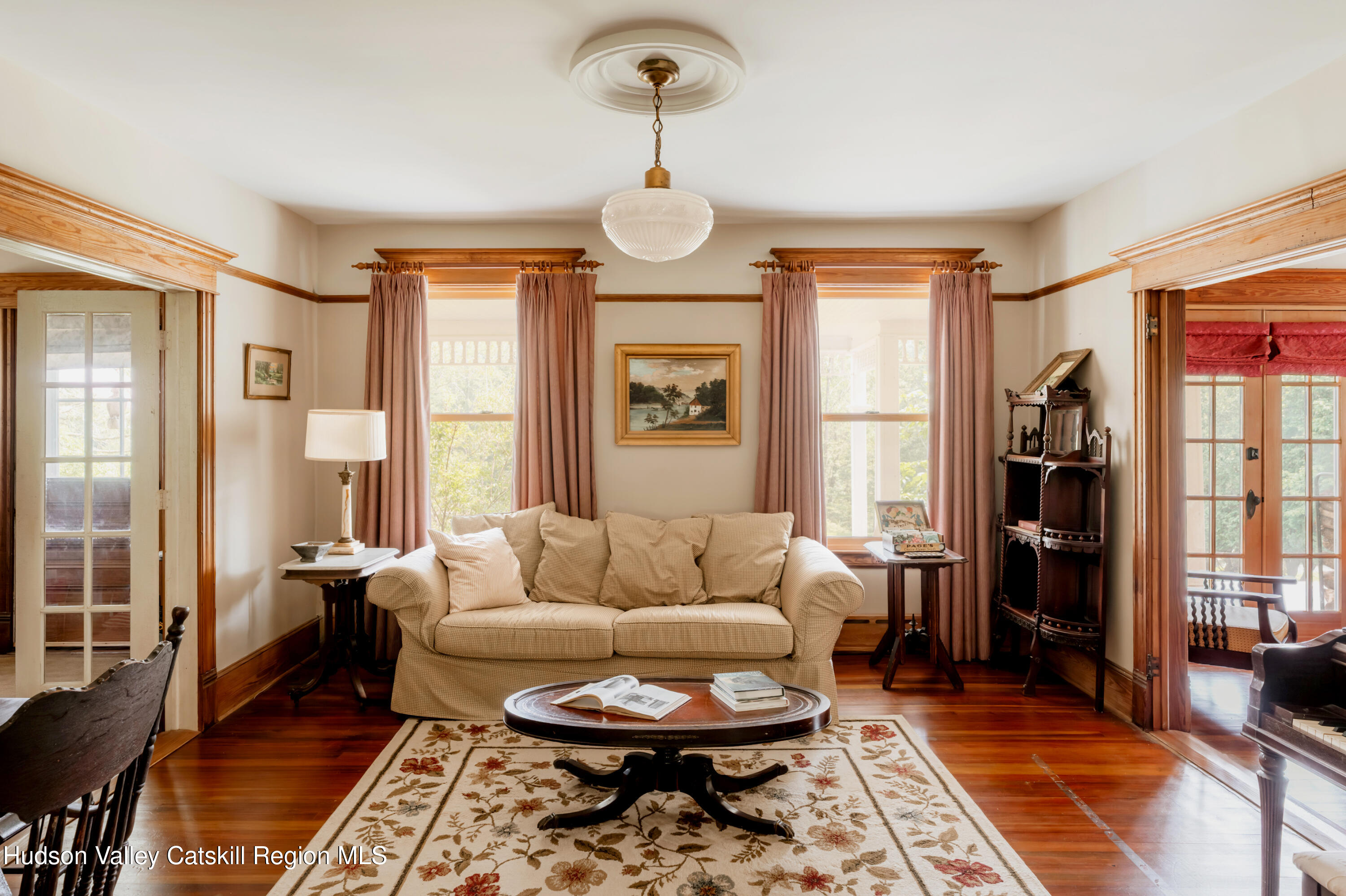 91 Old Hankins Road Callicoon, NY 12723 - Photo 17 of 41 a living room with furniture a table and a large window