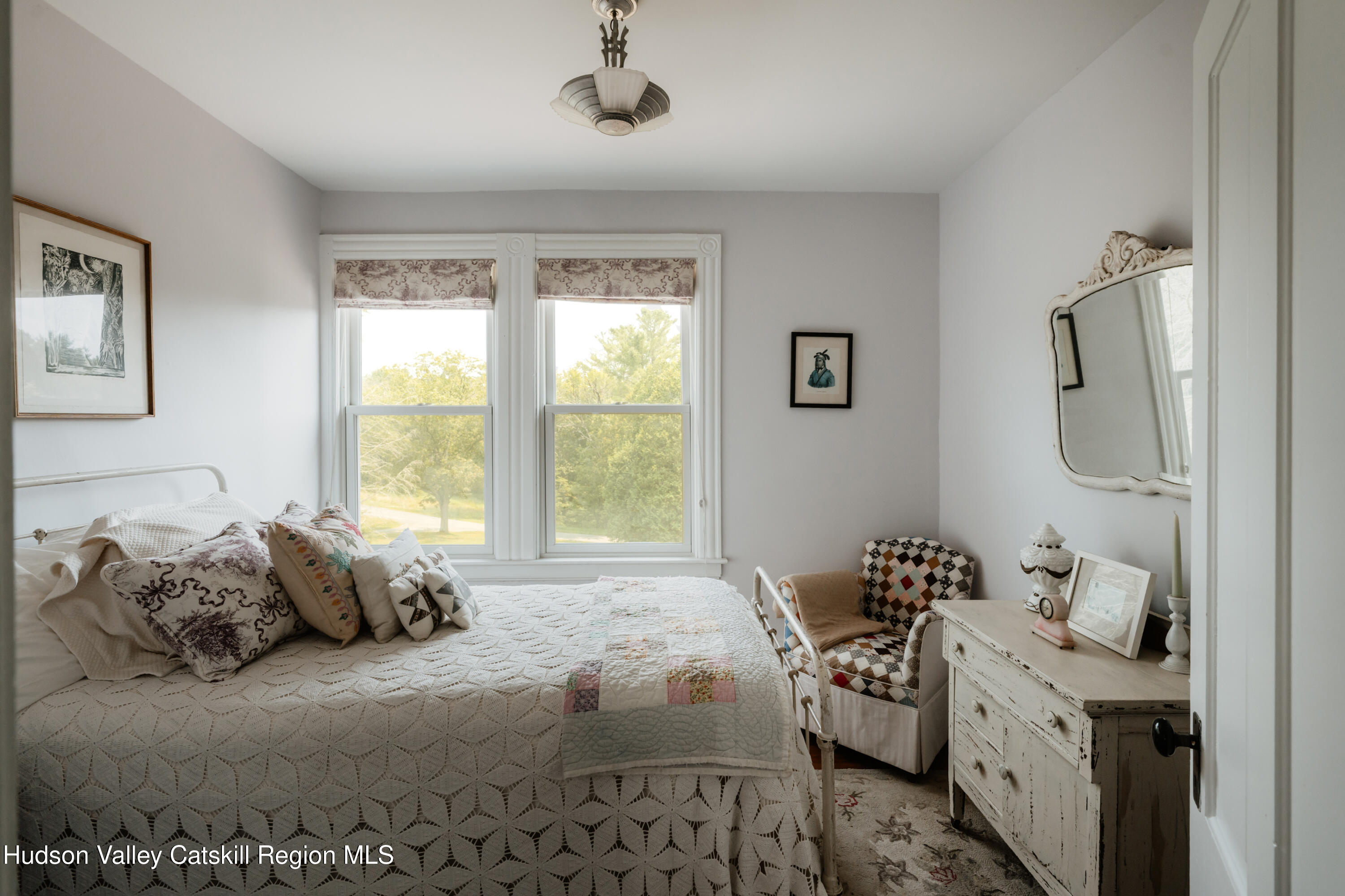 91 Old Hankins Road Callicoon, NY 12723 - Photo 24 of 41 a spacious bedroom with a bed and a window