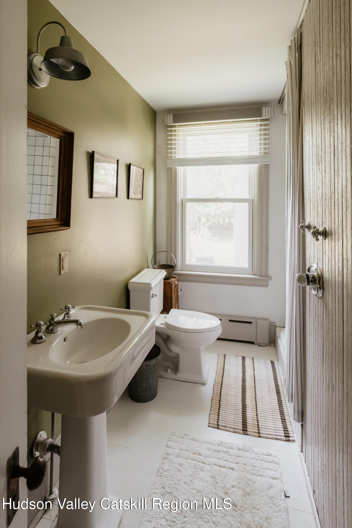 91 Old Hankins Road Callicoon, NY 12723 - Photo 27 of 41 a bathroom with a sink toilet and a mirror
