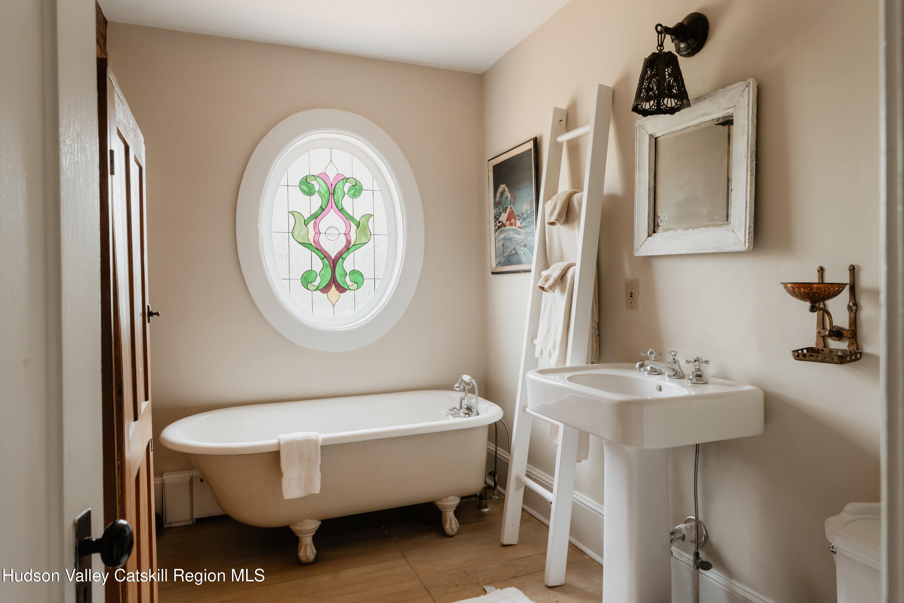 91 Old Hankins Road Callicoon, NY 12723 - Photo 31 of 41 a bathroom with a sink a mirror and a toilet