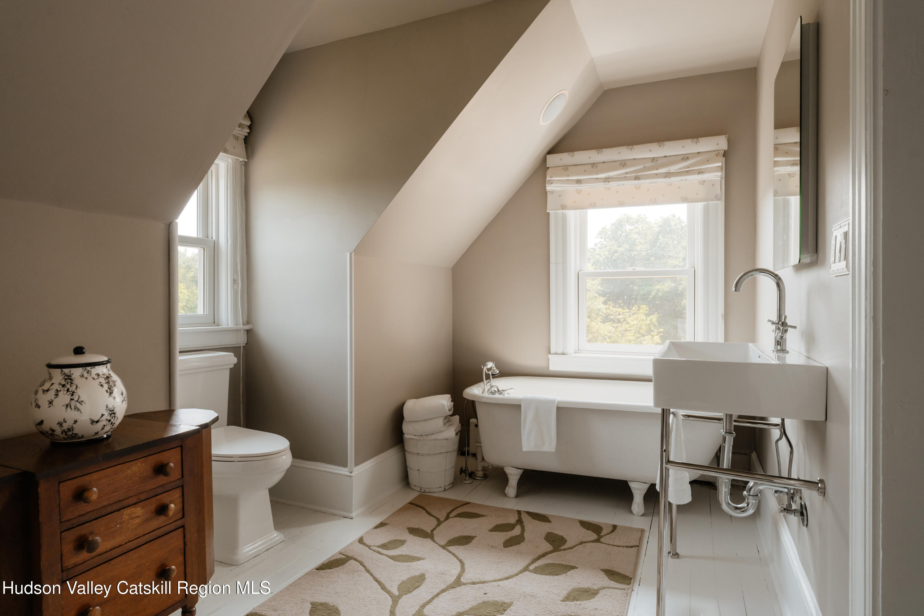 91 Old Hankins Road Callicoon, NY 12723 - Photo 36 of 41 a spacious bedroom with a bed and a table chair