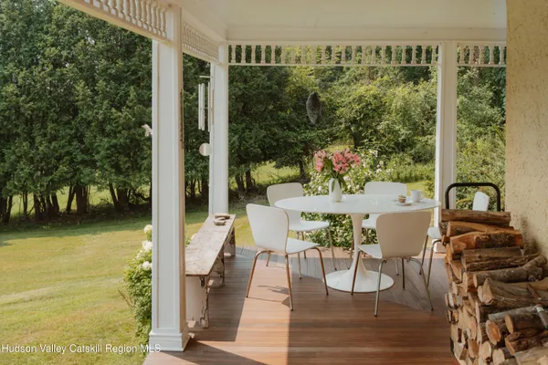 a dining room with furniture and wooden floor