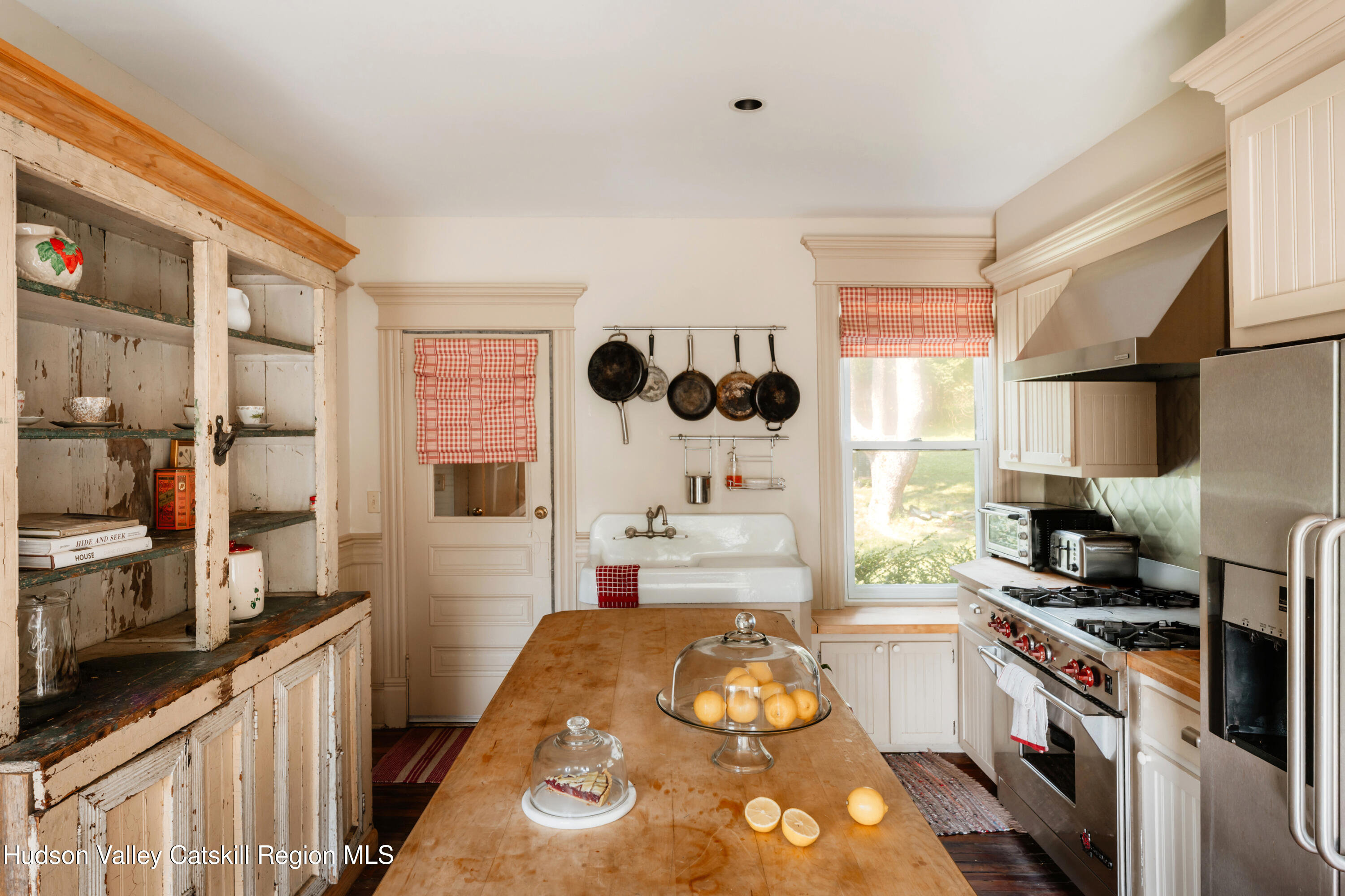 91 Old Hankins Road Callicoon, NY 12723 - Photo 7 of 41 a kitchen with a sink stove top oven and cabinets