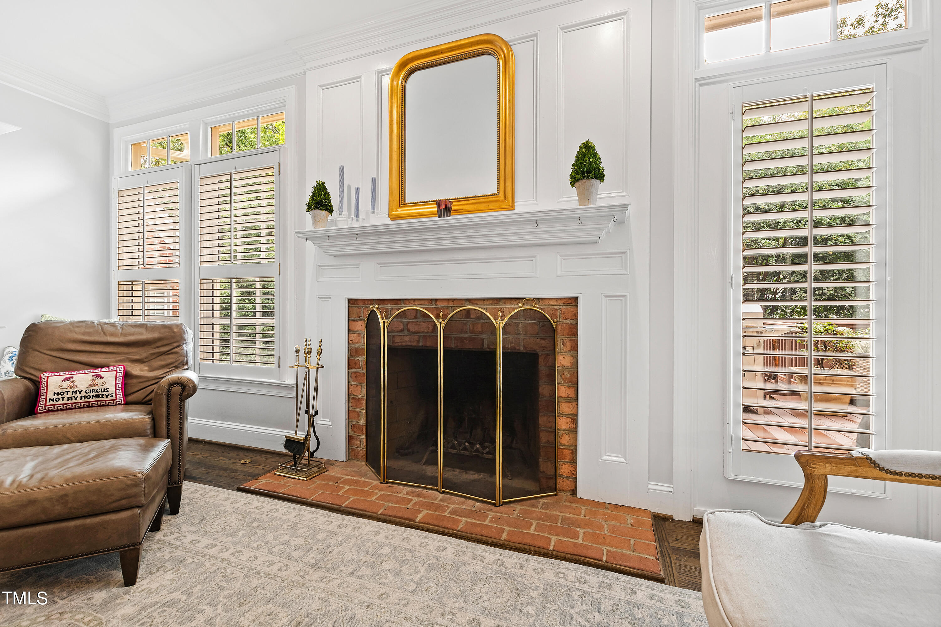 1205 Ballyhask Place Raleigh, NC 27607 - Photo 18 of 53 a living room with furniture and a fireplace