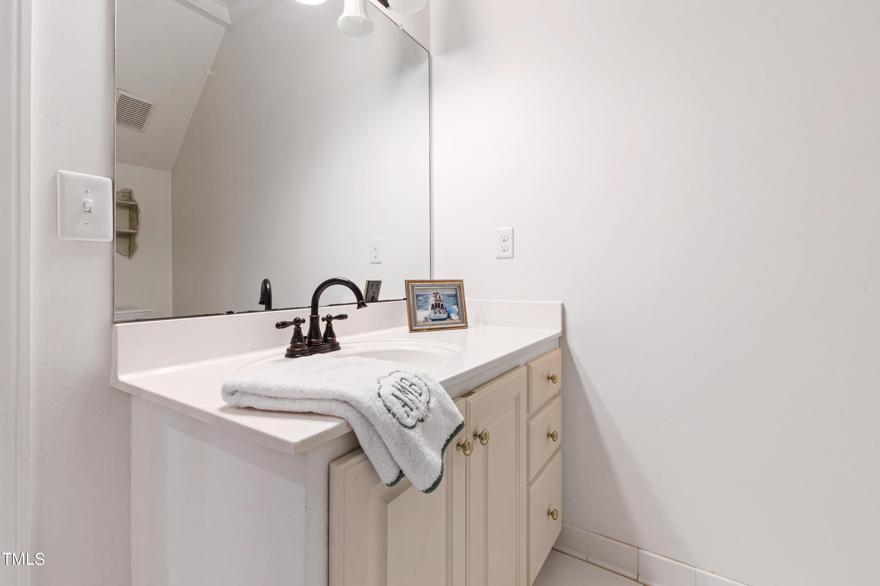 1205 Ballyhask Place Raleigh, NC 27607 - Photo 33 of 53 a close view of sink and tap