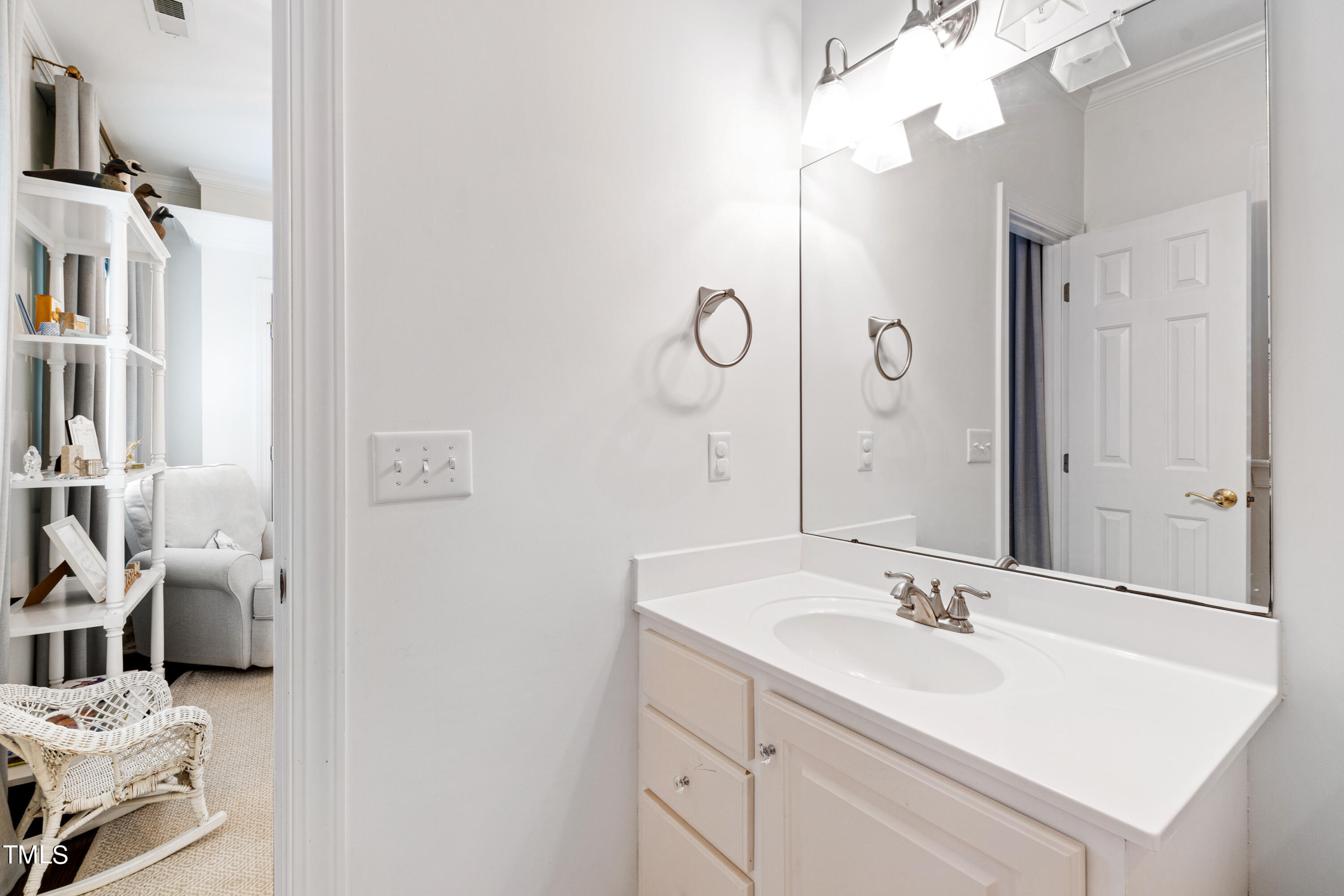 1205 Ballyhask Place Raleigh, NC 27607 - Photo 36 of 53 a bathroom with a sink vanity and a mirror