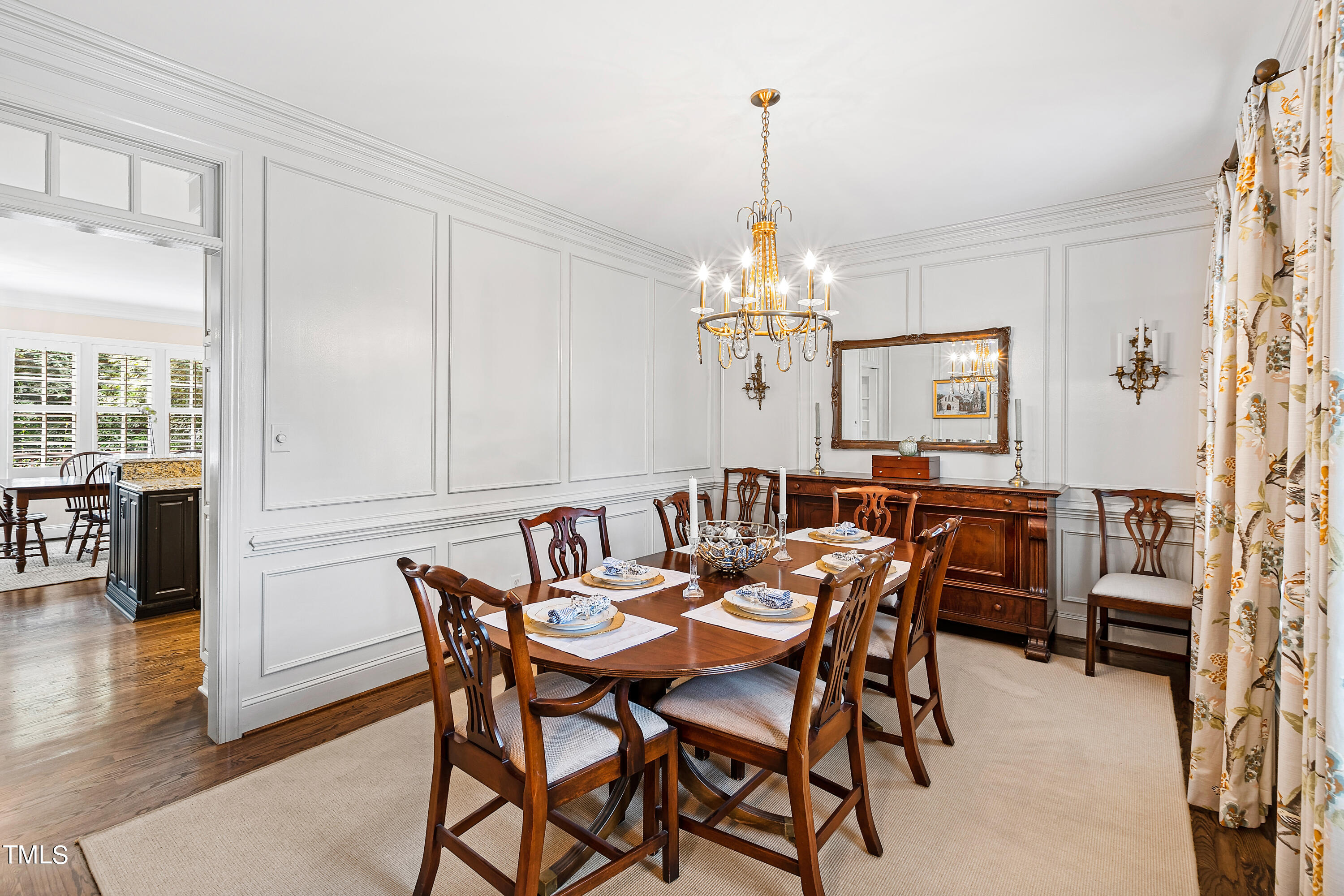 1205 Ballyhask Place Raleigh, NC 27607 - Photo 7 of 53 a view of a dining room with furniture window and wooden floor