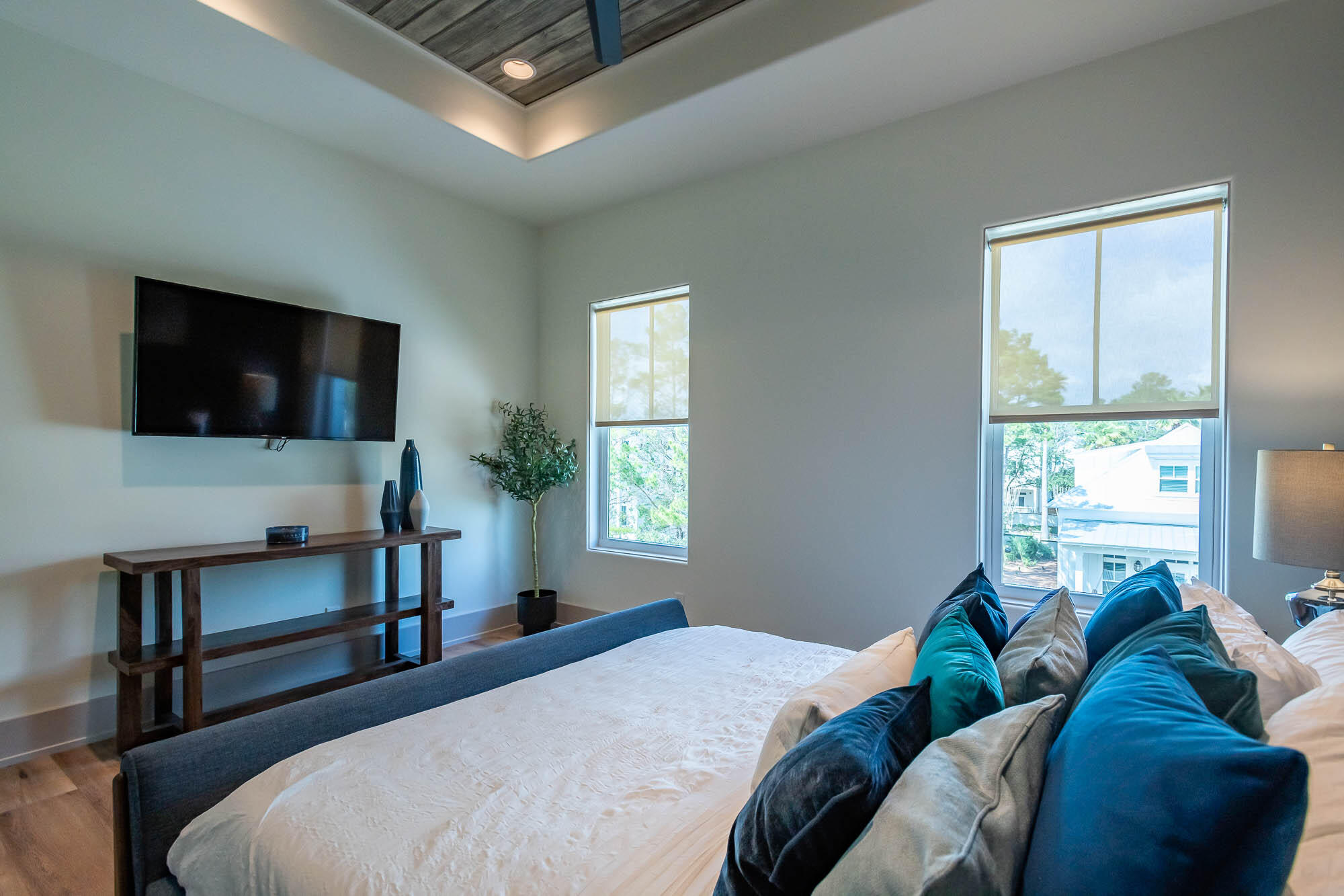 151 Grande Pointe Dr Inlet Beach Inlet Beach, FL 32461 - Photo 27 of 32 a bedroom with a bed tv and a window