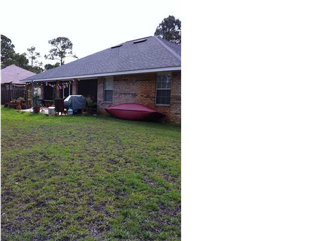 552 Shipwreck Road Santa Rosa Beach, FL 32459 - Photo 3 of 3 a front view of a house with garden