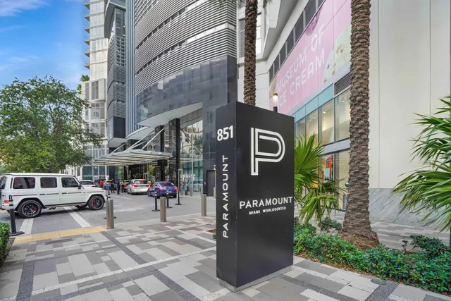 a view of a kitchen with furniture and floor to ceiling window