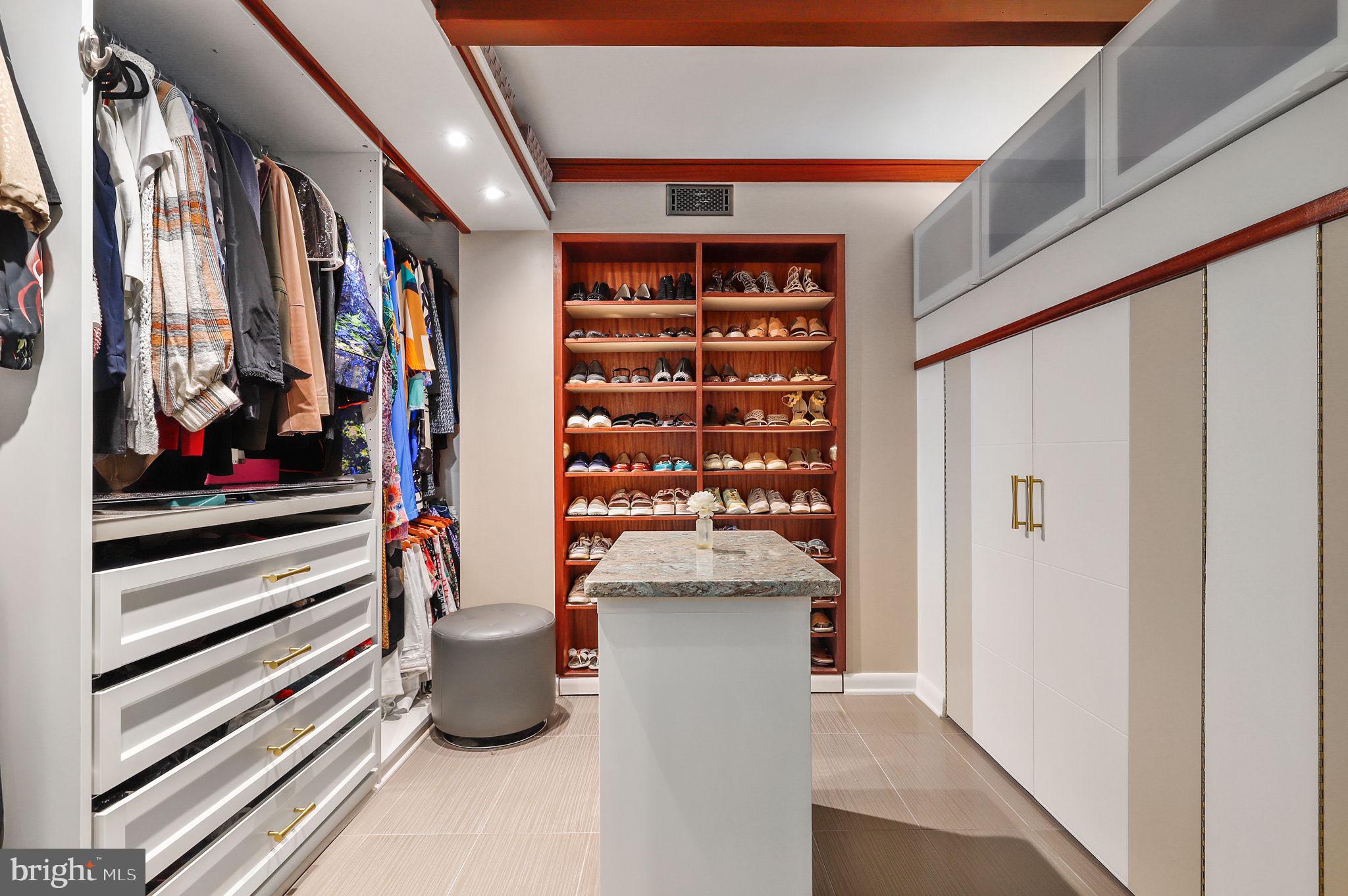1104 High Country Road Towson, MD 21286 - Photo 83 of 116 a view of walk in closet with clothes and shoes