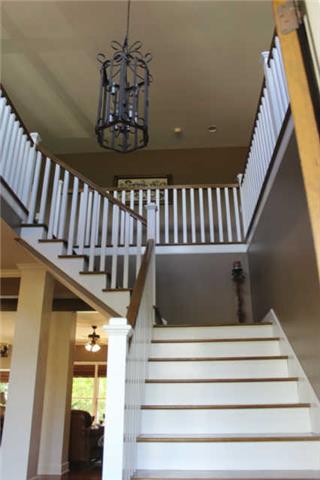 6871 Choctaw Road College Grove, TN 37046 - Photo 5 of 20 The stairs led you to the landing where there are 2 bedrooms, 2 unfinished walk in attics and an excellent space for a library.