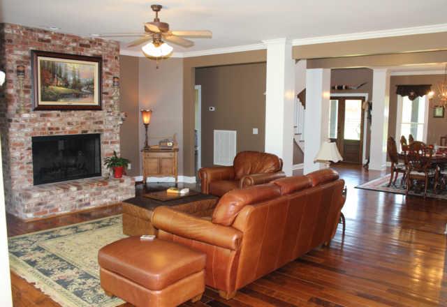 6871 Choctaw Road College Grove, TN 37046 - Photo 7 of 20 Living area is open to the dining room, kitchen and breakfast area. Beautiful distressed hardwood floors throughout the main level of the house.