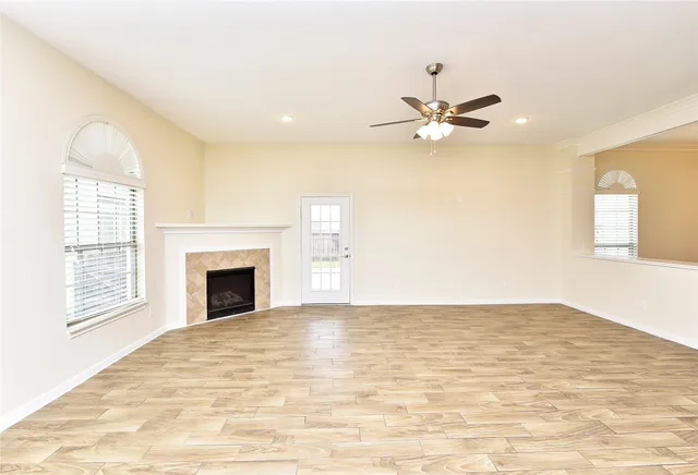 a view of empty room with a fireplace