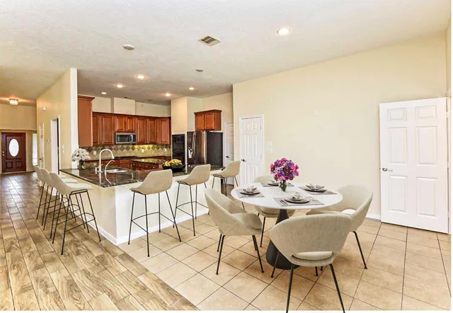 a view of a dining room with furniture