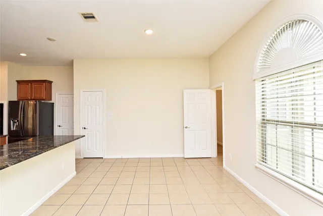 a view of an empty room and window