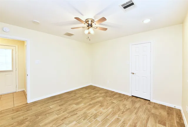 a bathroom with a tub shower and a sink
