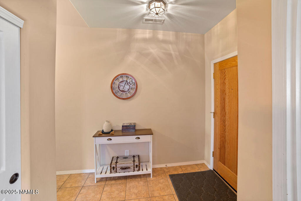 603 Brookline Loop Williams, AZ 86046 - Photo 12 of 57 a room with a table and a chandelier