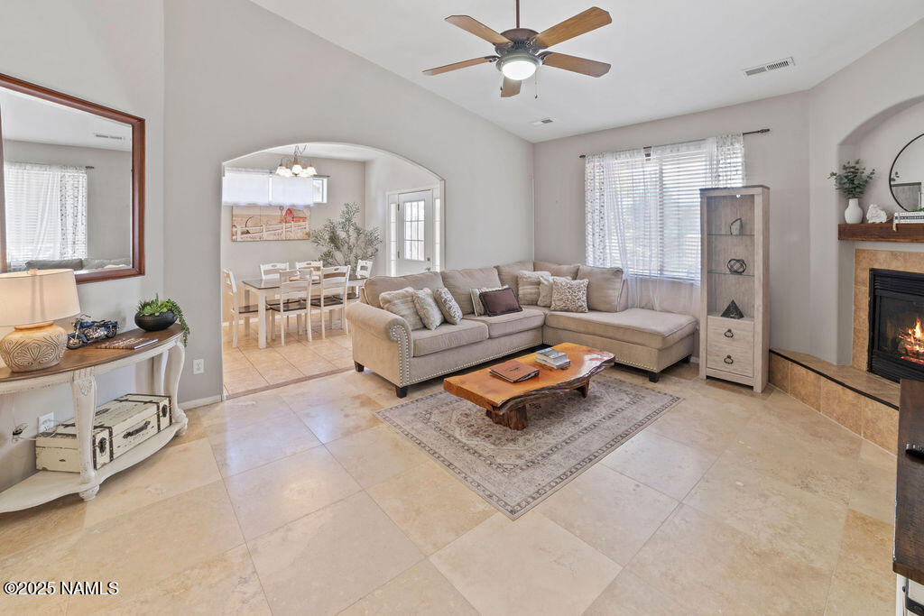 603 Brookline Loop Williams, AZ 86046 - Photo 15 of 57 a living room with furniture and a chandelier