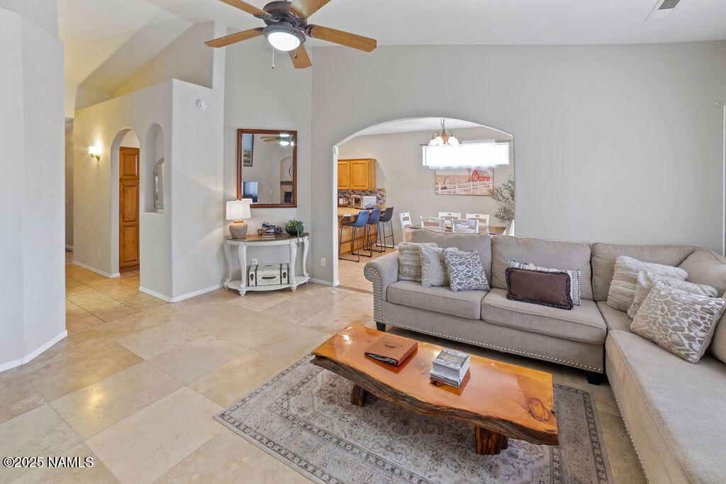 603 Brookline Loop Williams, AZ 86046 - Photo 16 of 57 a living room with furniture and a chandelier