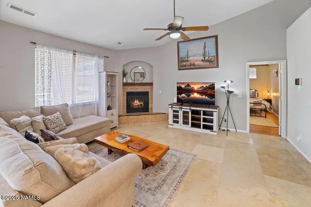 a view of a dining room with furniture and a kitchen