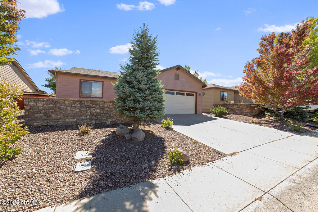 603 Brookline Loop Williams, AZ 86046 - Photo 3 of 57 a front view of a house with a yard and garage