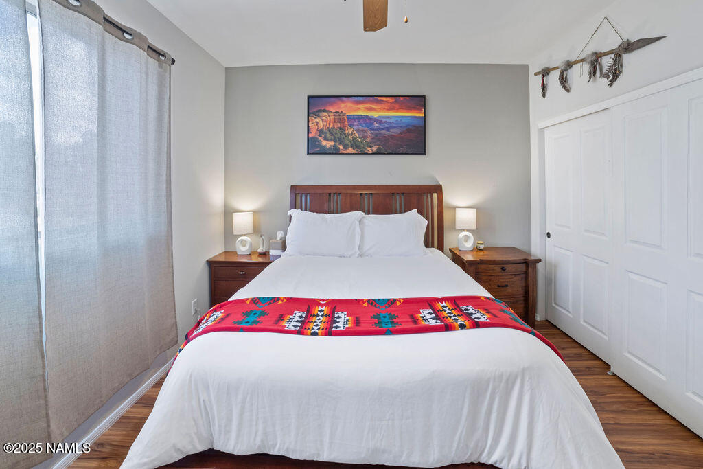 603 Brookline Loop Williams, AZ 86046 - Photo 35 of 57 a bedroom with a bed and a night stand